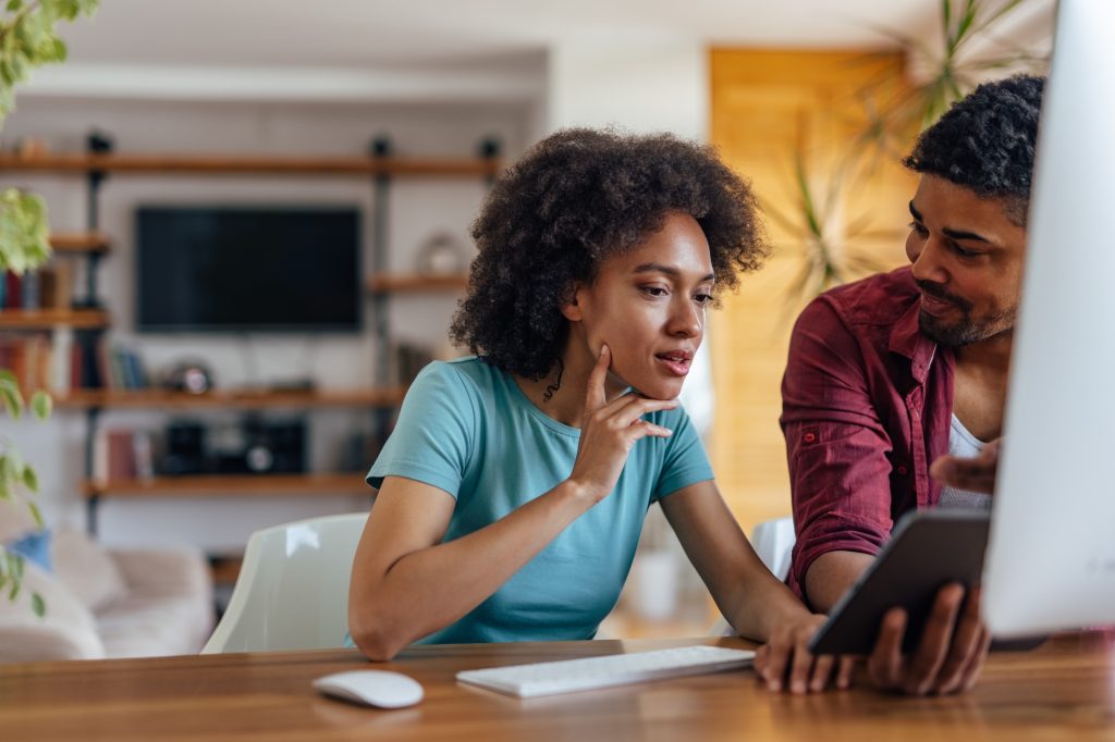 Adult woman, being mentored by her senior partner.